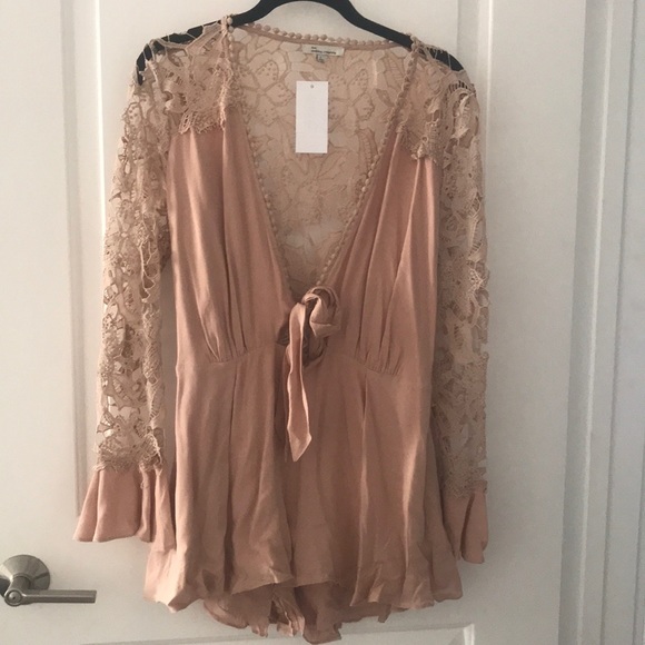Showpo. Other - New with tags Beige Lace Romper